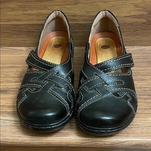 Clarks Black Leather Flats with Stitch Detailing.